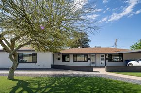 Phoenix apartment for rent - A house with a tree in front of it.